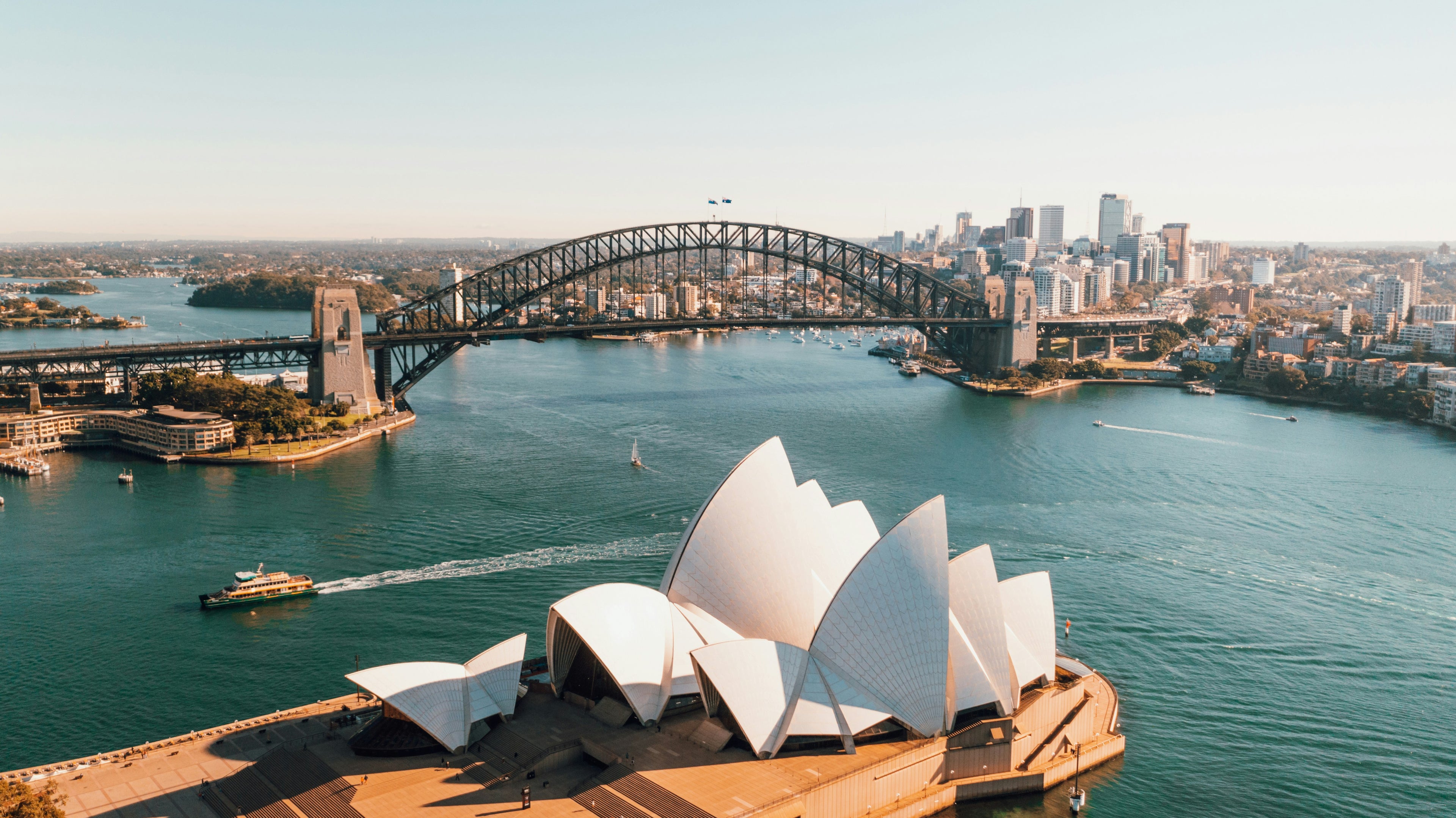 Sydney Opera House and Harbour Bridge with a clear blue sky