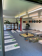 Top-down view of a room with decorative items on shelves and a table.