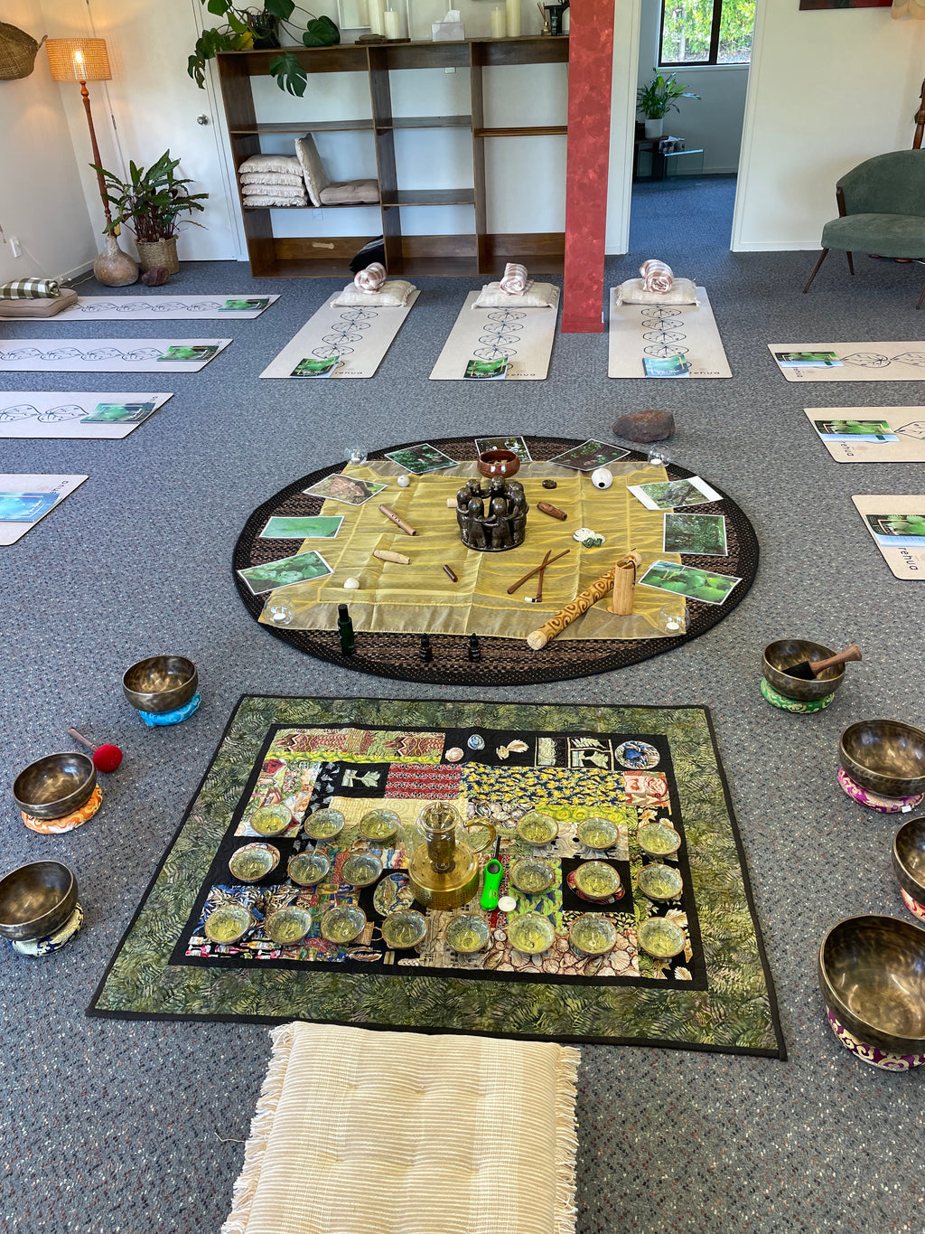 Decorative wall art with circular and square designs on a gray wall.