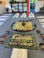 Decorative wall art with circular and square designs on a gray wall.