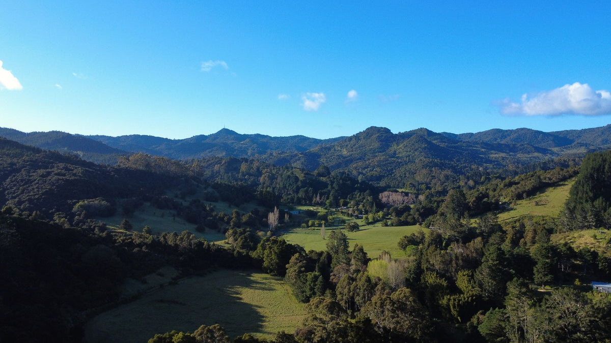 Scenic view of mountains and valleys with clear blue sky