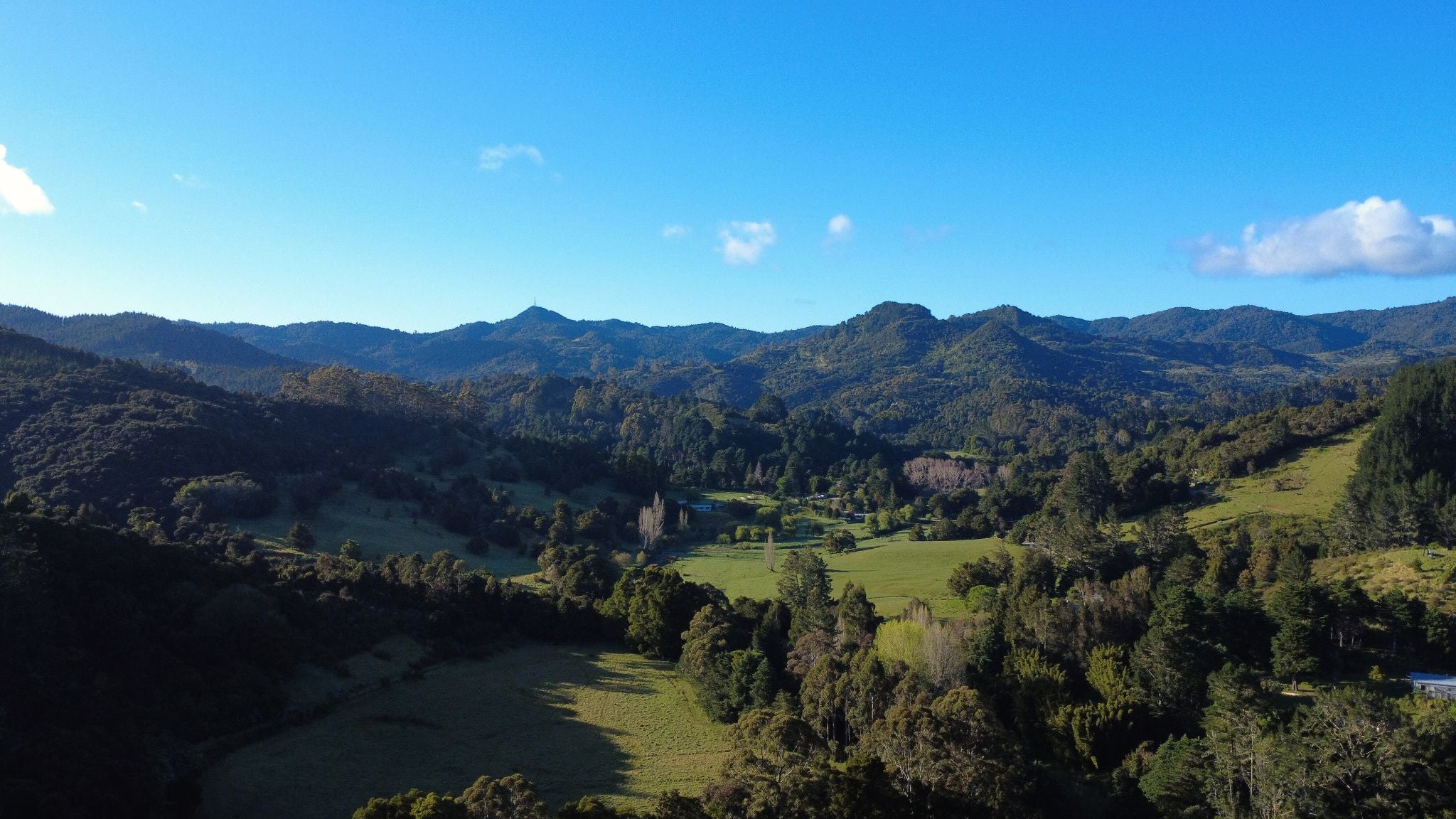 Scenic view of mountains and valleys with clear blue sky