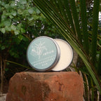 decongestant  'rehua' product on a stone surface with green foliage in the background