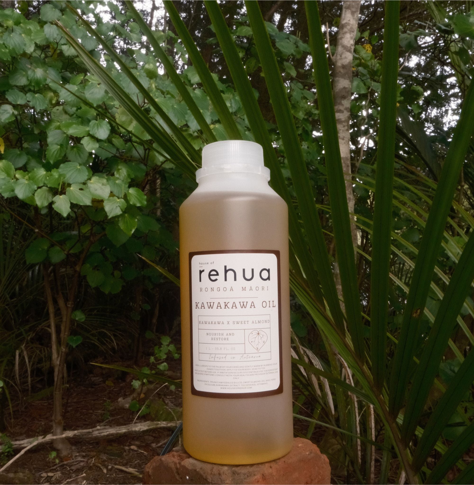 Bottle of rehua Kawakawa Oil against a natural background