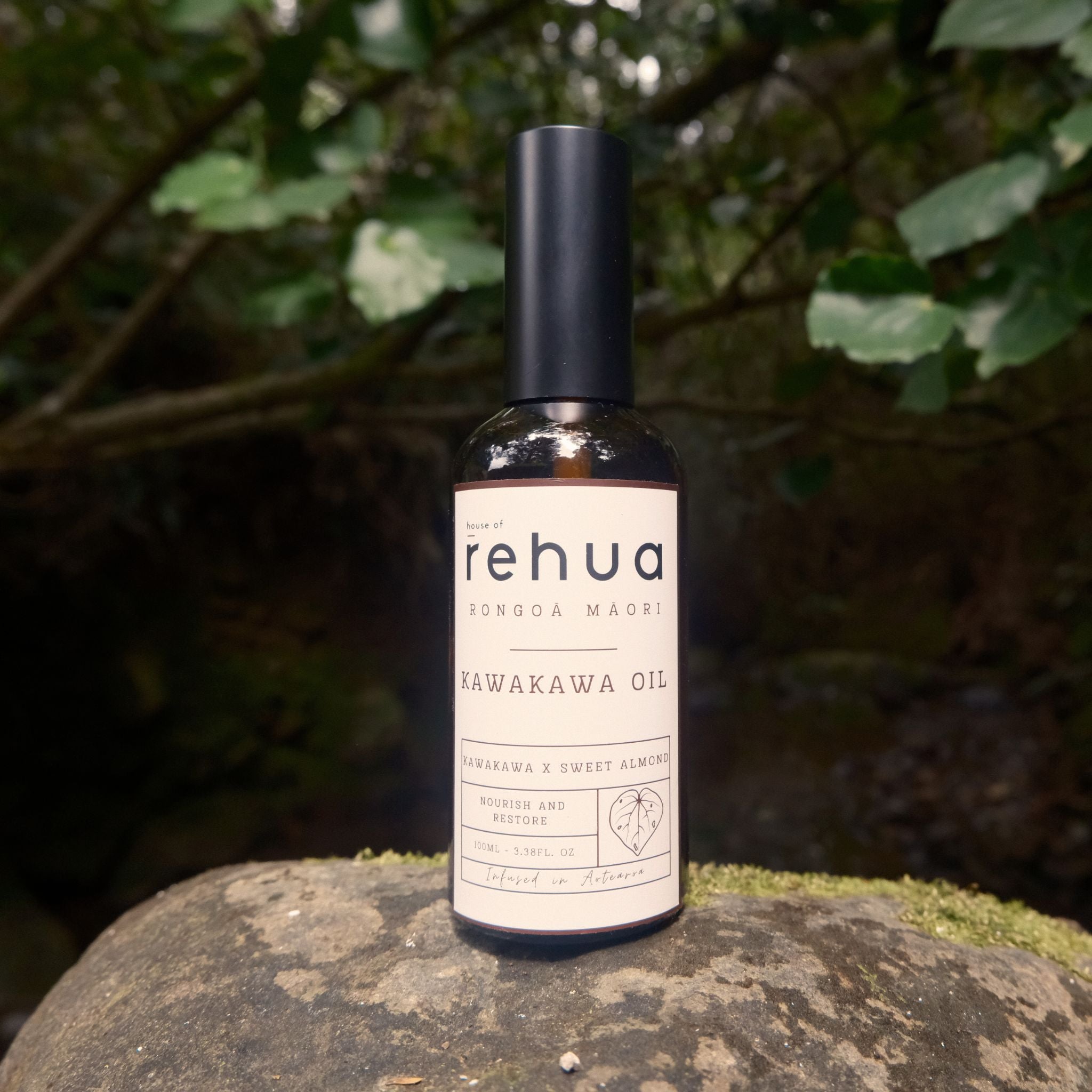 Bottle of Rehua kawakawa Oil on a stone with a natural background