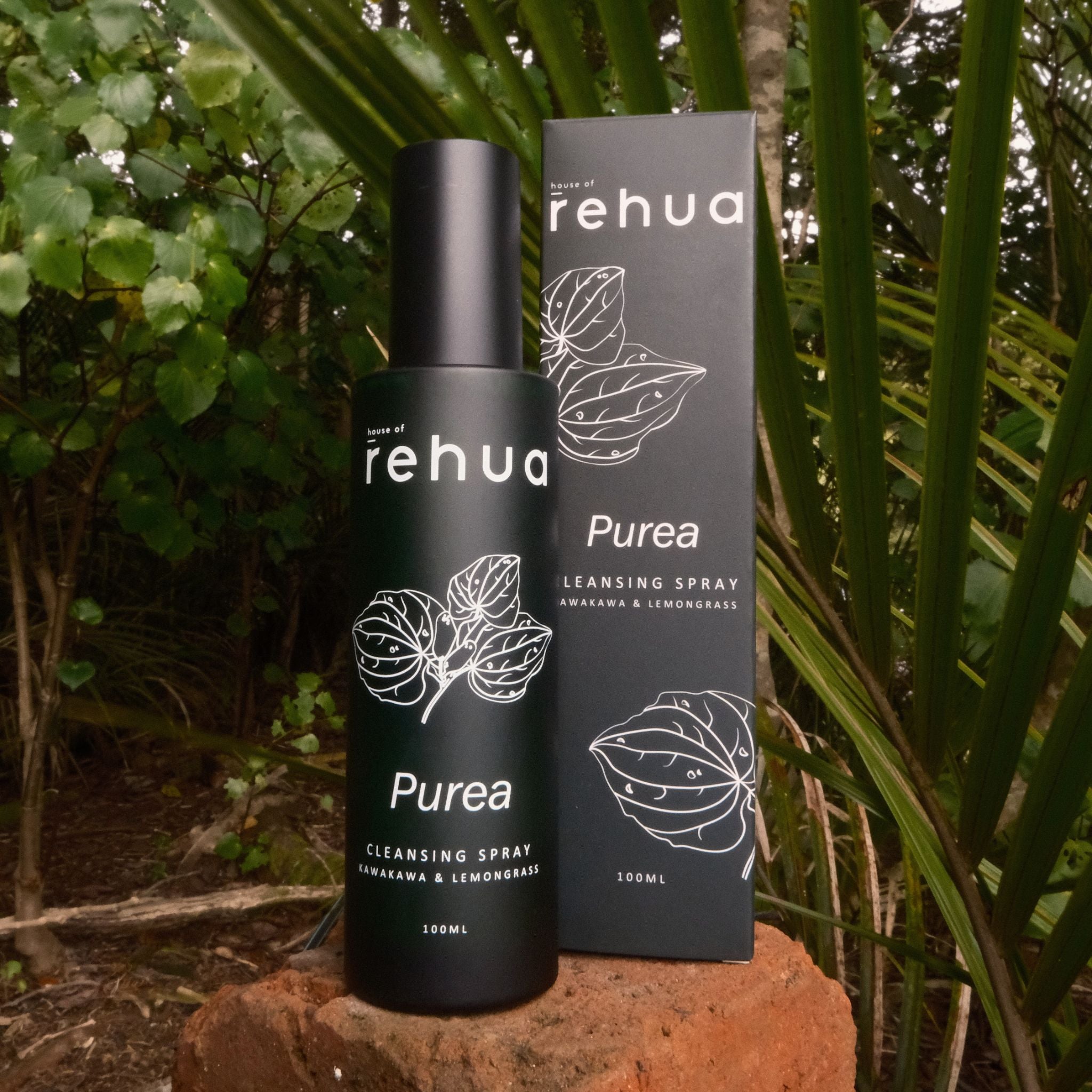 rehua Purea cleansing spray bottle and packaging on a natural background