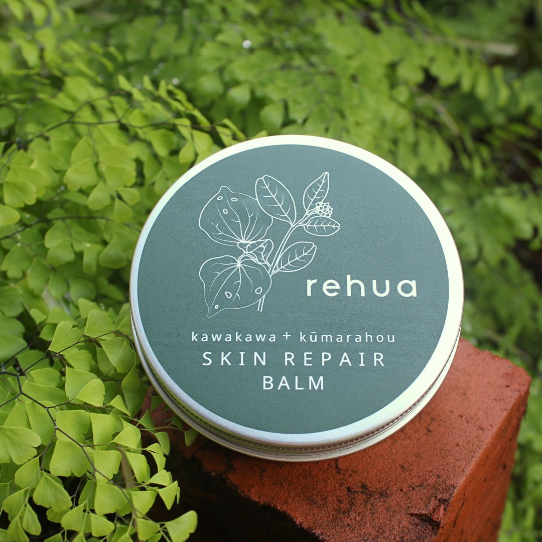 Skin repair balm container with 'rehua' branding on a natural background
