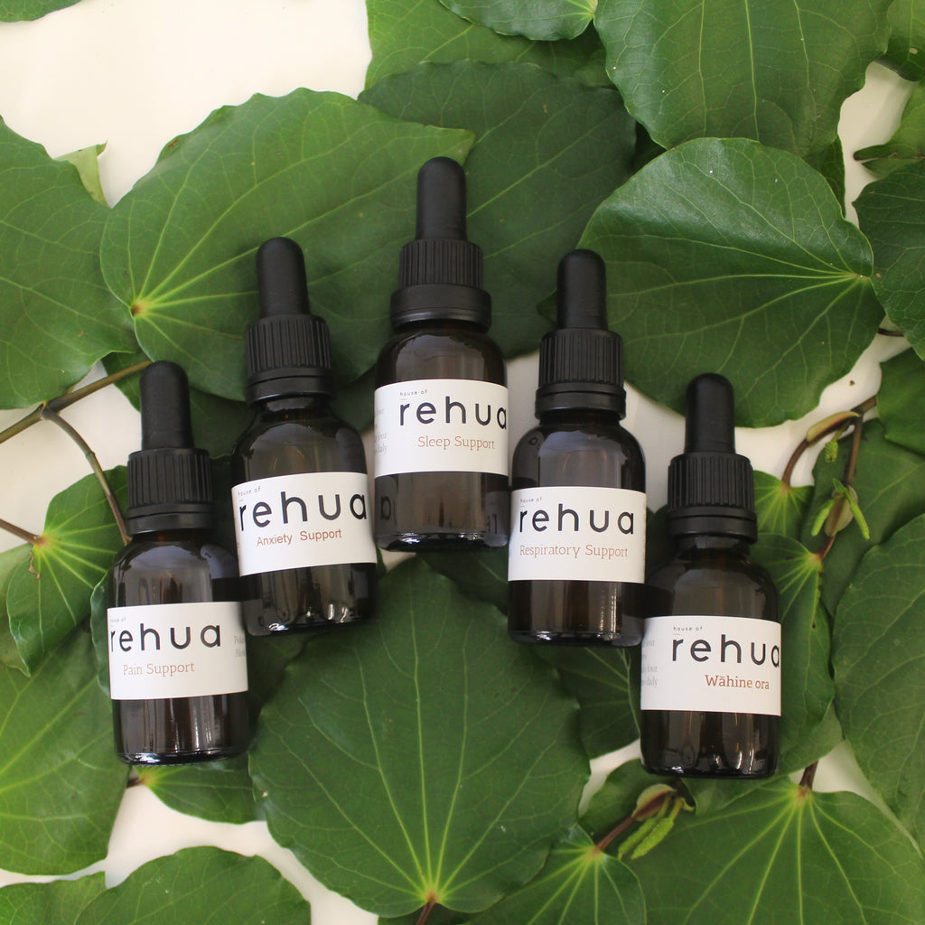Set of House of Rehua Rongoā Tincture bottles on kawakawa leaves