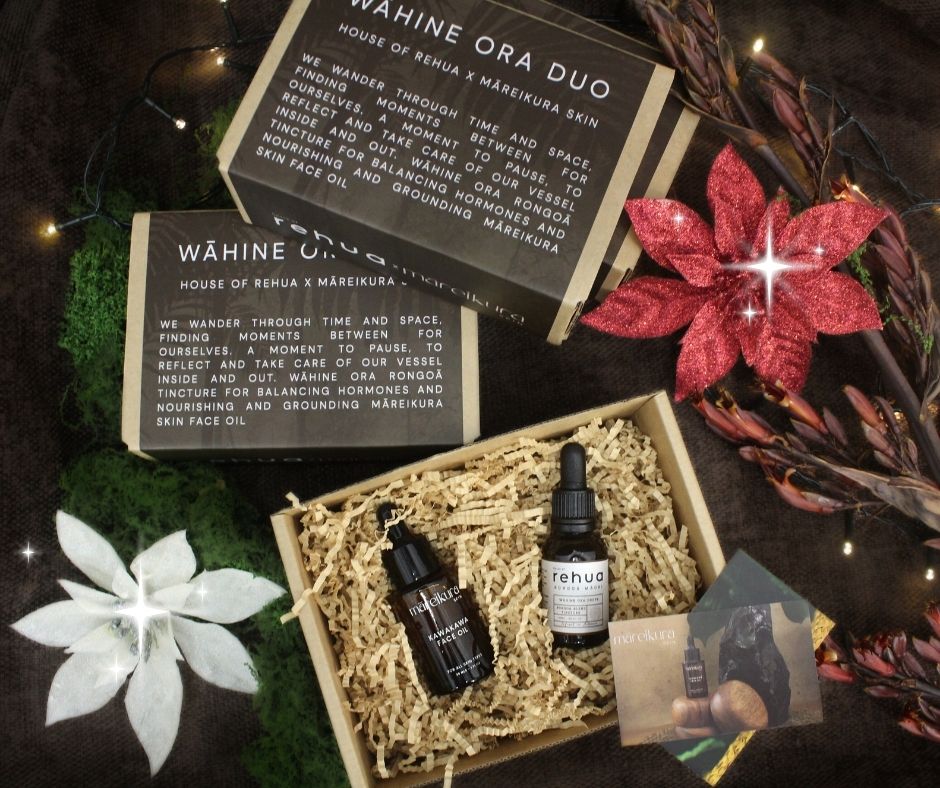 Skincare products in a box with 'Wáhine Ora' branding and decorative flowers.