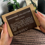 A person holding the Kawakawa Collection gift box - The perfect self-care gift for birthdays, Matariki, or Christmas.