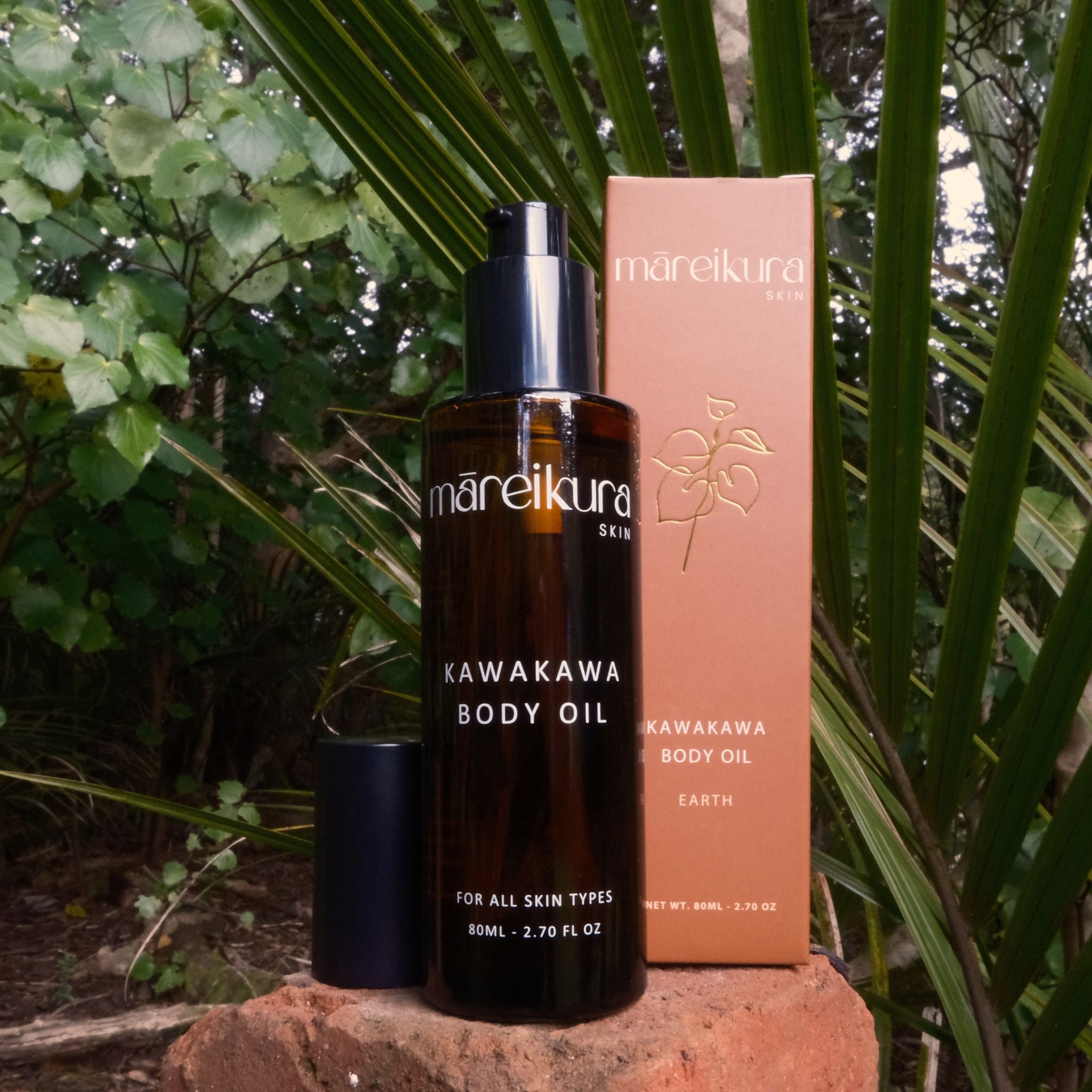 Mareikura Kawakawa Body Oil bottle and packaging against a natural background