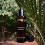 Bottle of mareikura skin Kawakawa body oil on a natural background with greenery.