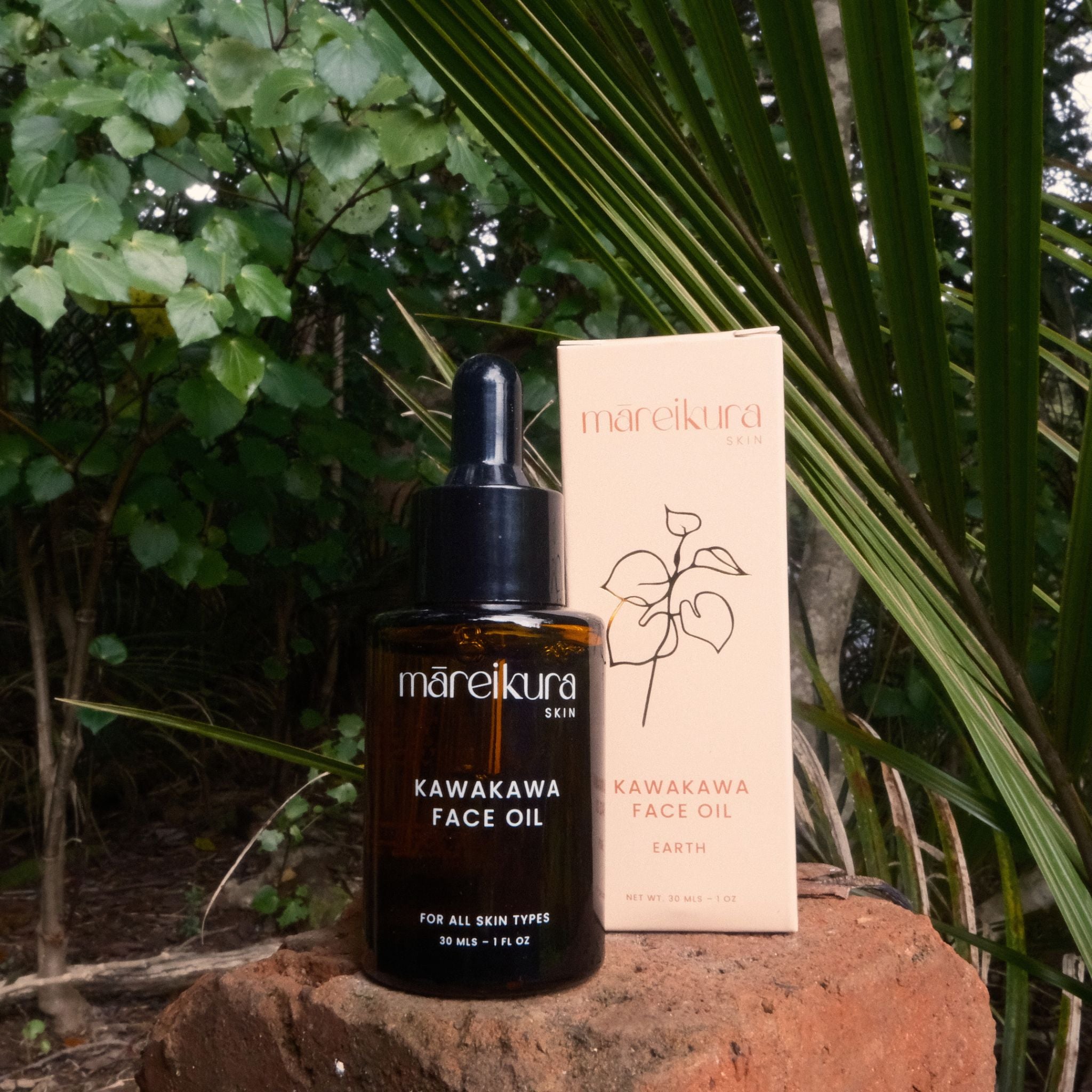 Mareikura Kawakawa Face Oil bottle and packaging on a natural background